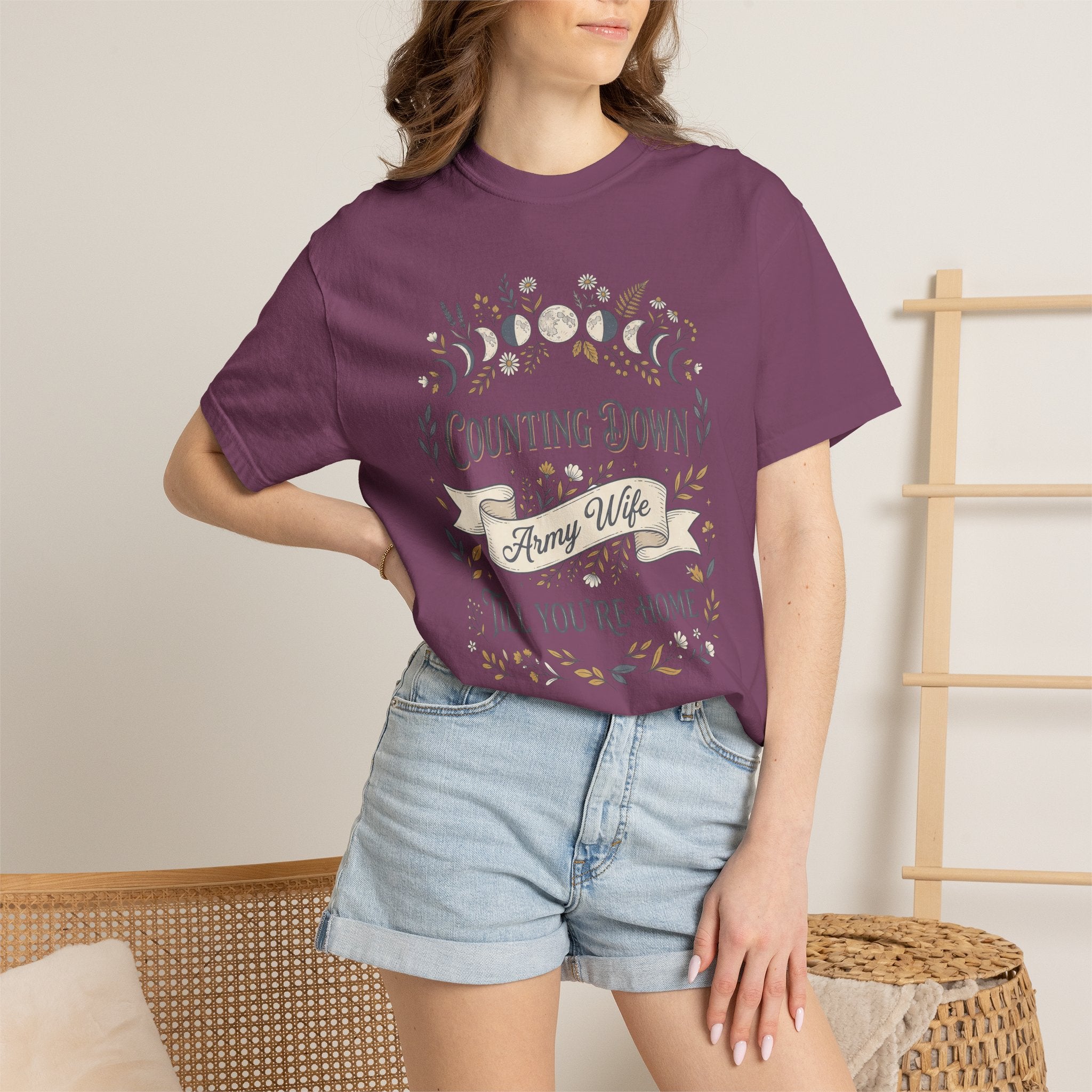 Plum T-shirt worn by model with floral “Counting Down” and “Army Wife”