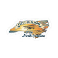 First in Flight North Carolina sticker with airplane graphic and “9 am North Carolina”.