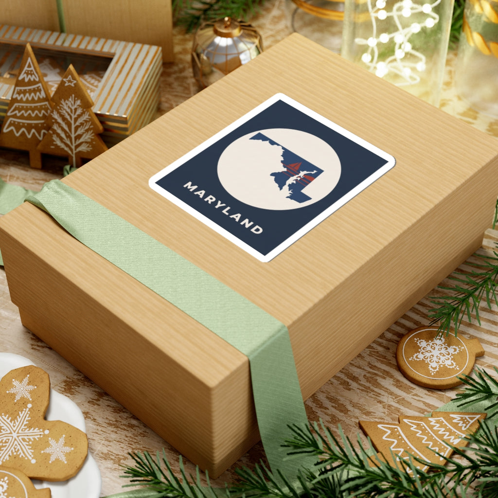 Maryland sticker on a holiday gift, square navy label with circular state and sailboat