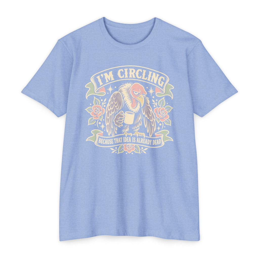 Light blue vulture graphic T-shirt with winged face and “I’m circling” text