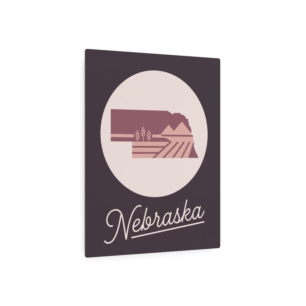 Mauve Nebraska metal wall plaque with oval landscape emblem and 'Nebraska' cursive