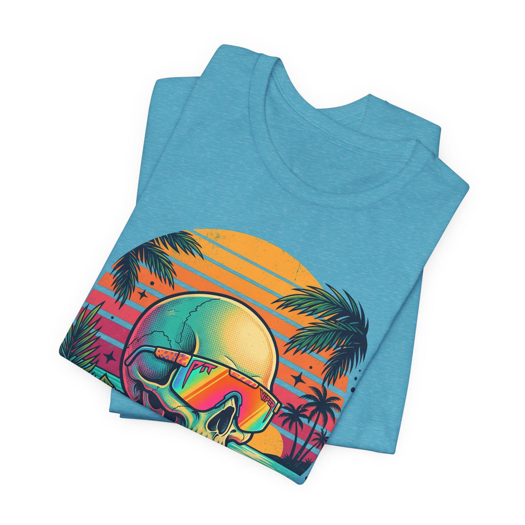 Teal T-shirt folded with tropical skull and rainbow sunglasses sunset palm print