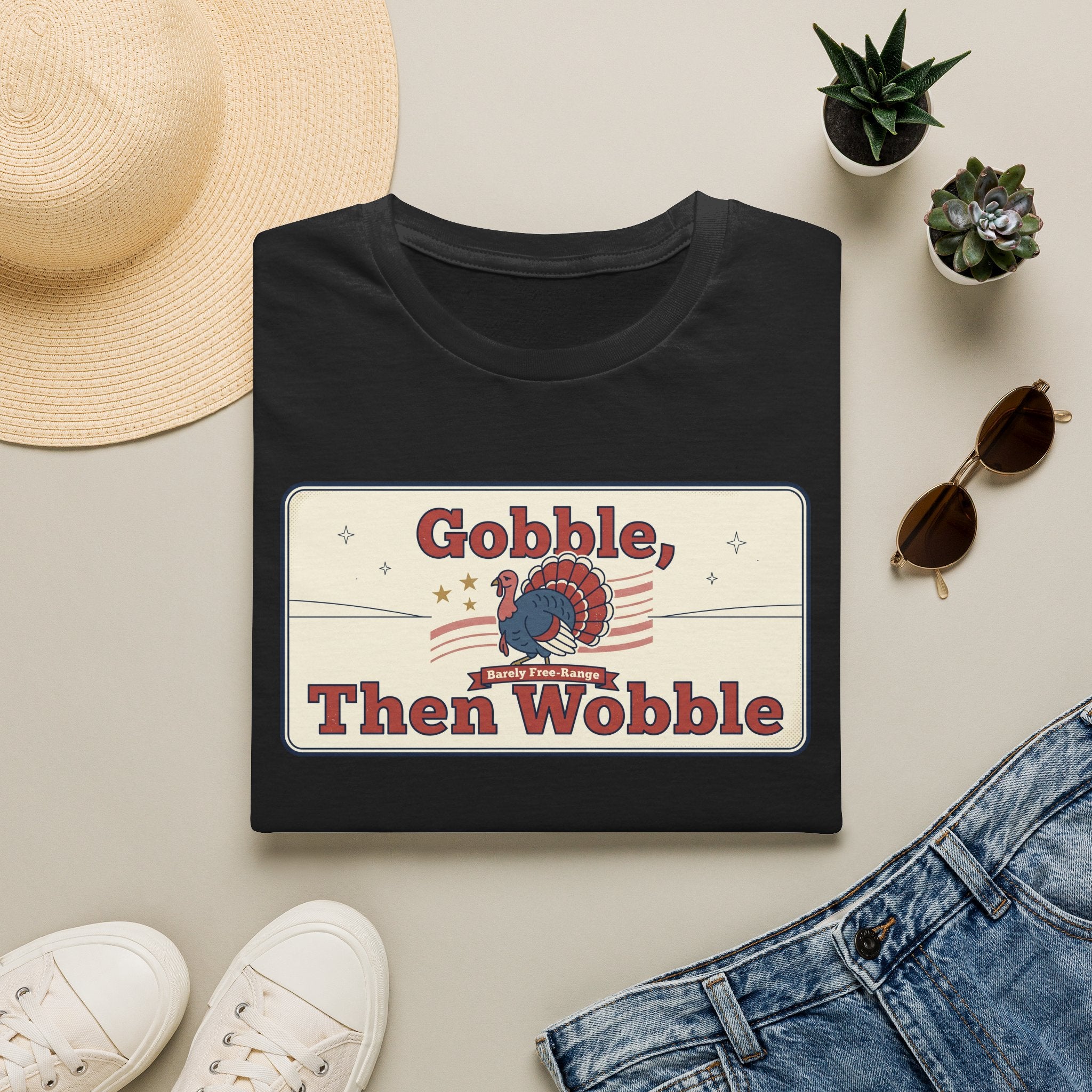 Black T-shirt with retro turkey graphic and bold “Gobble, Then Wobble” text