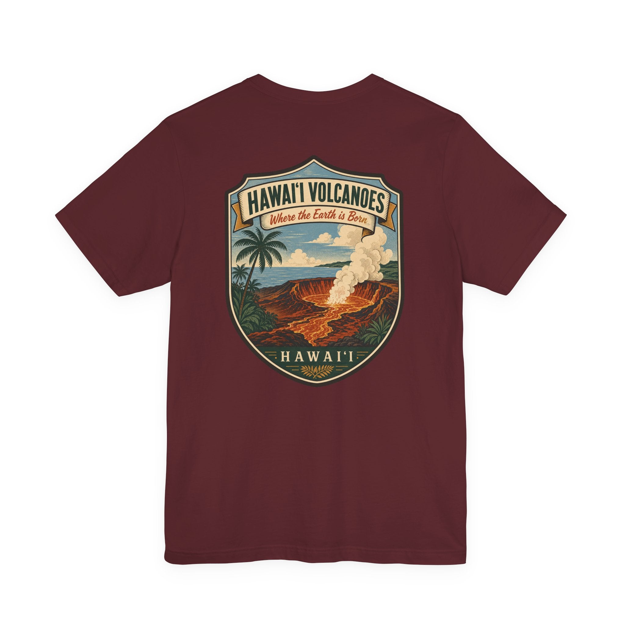Burgundy short-sleeve T-shirt with large shield graphic reading “Hawai'i Volcanoes”.