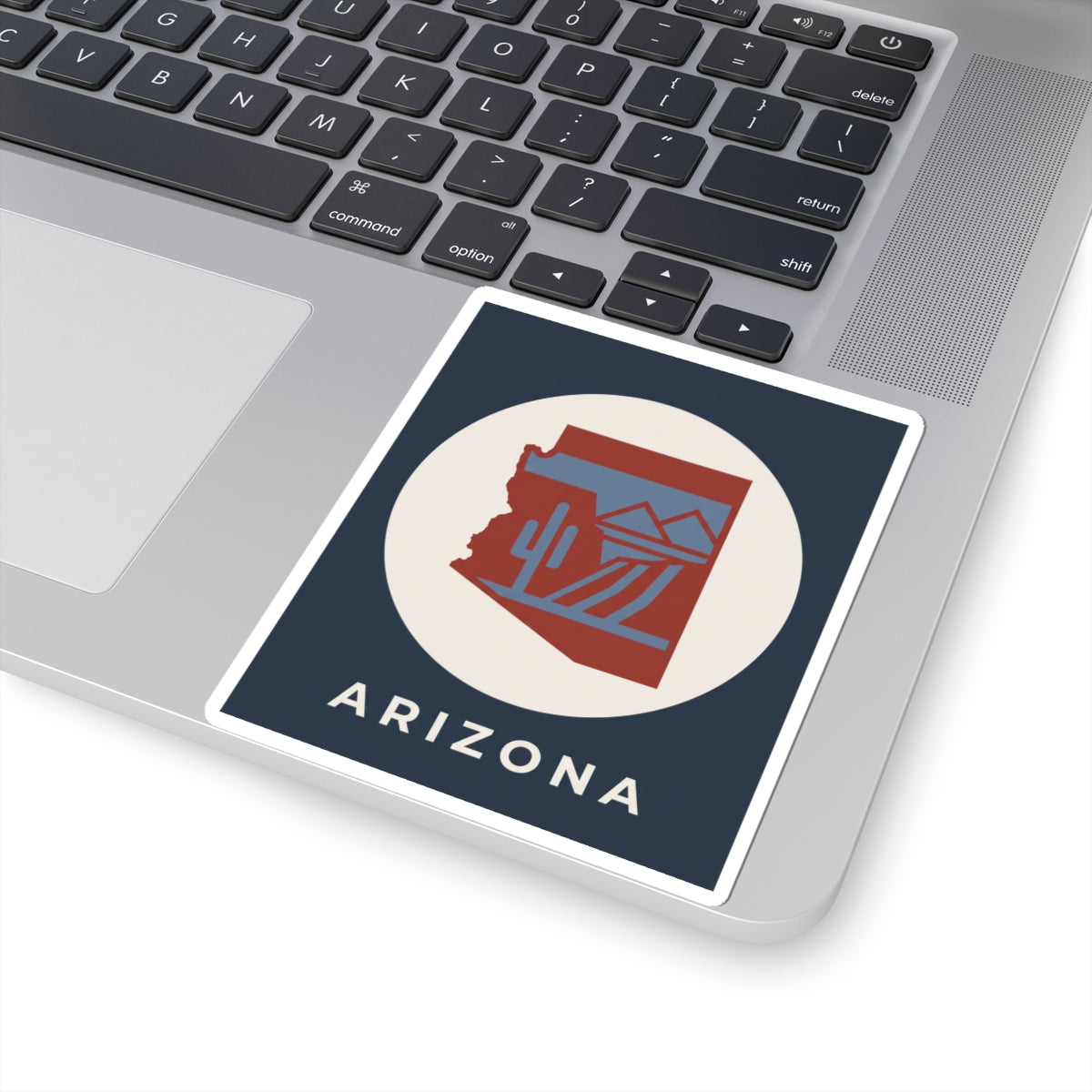 Square Arizona sticker on laptop with cactus desert graphic and “ARIZONA” text