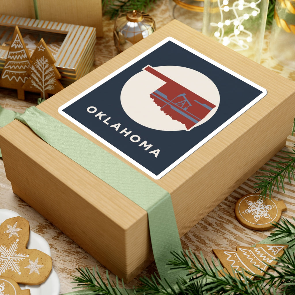 Kiss-cut vinyl Oklahoma sticker on wrapped gift box with oil rig and OKLAHOMA
