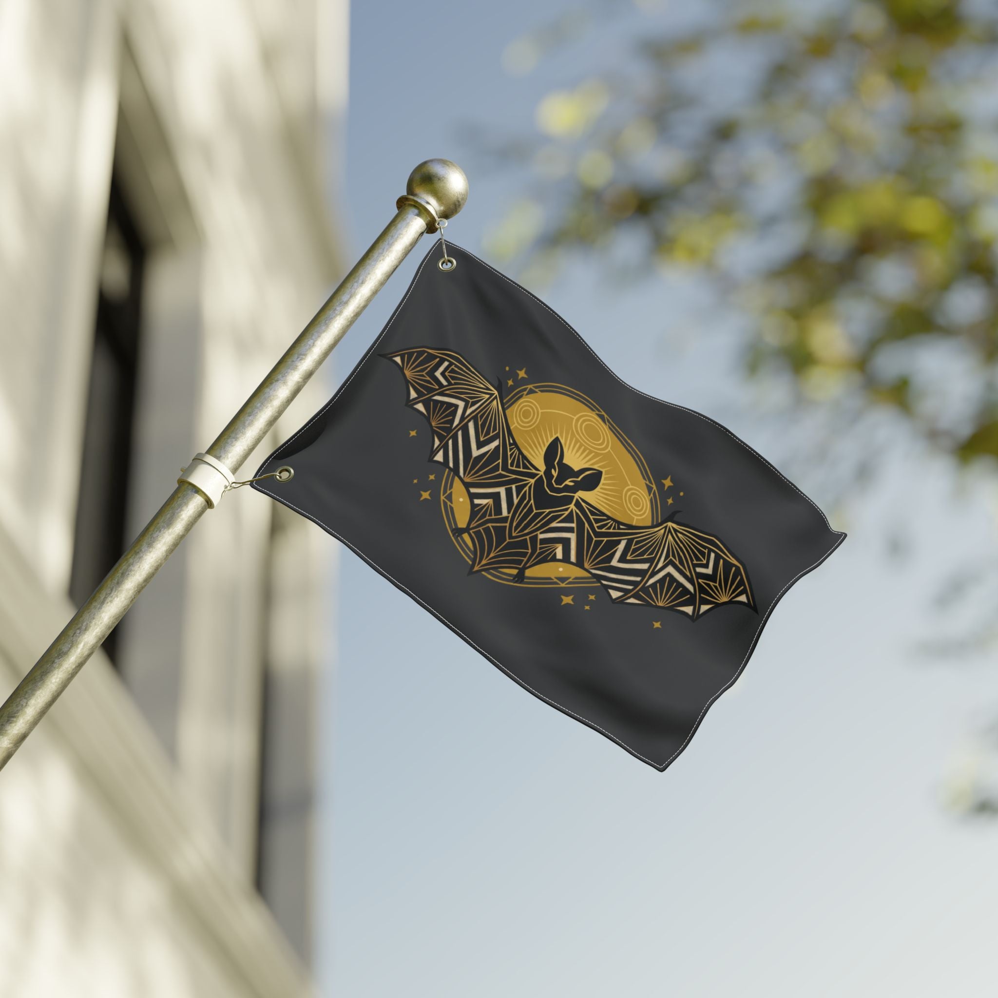 Bat banner flag on pole; dark fabric with gold art deco bat and crescent moon motif
