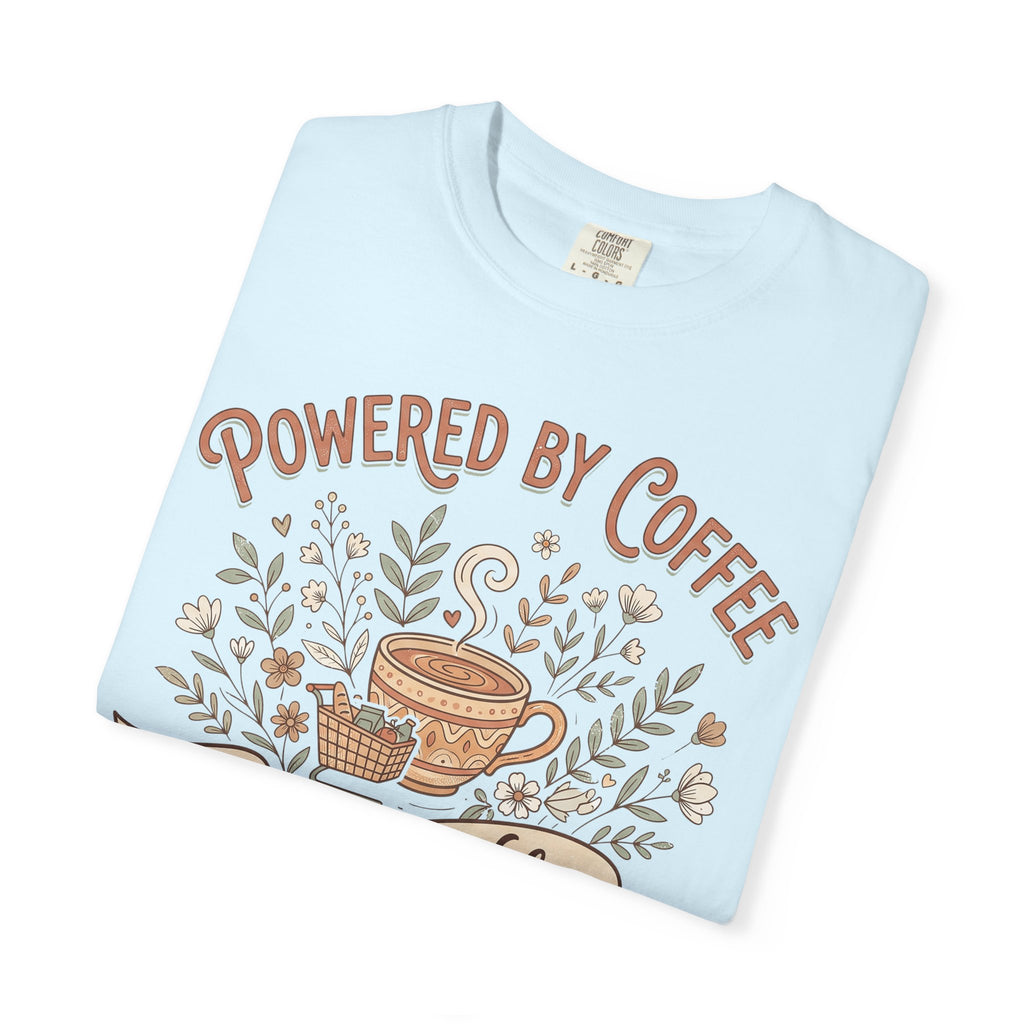 Light blue T-shirt with Powered by Coffee text and coffee cup floral graphic