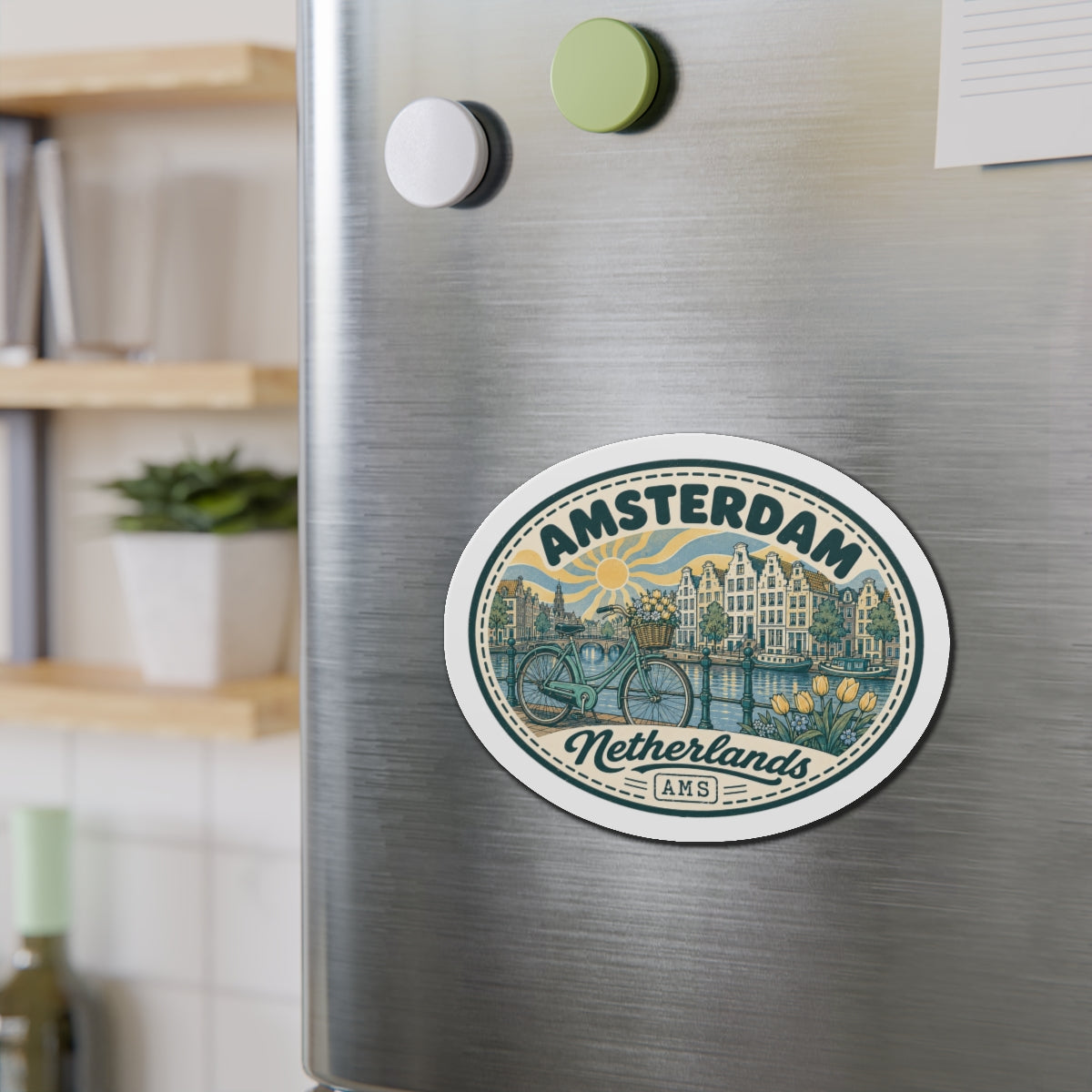 Round die-cut Amsterdam Netherlands travel magnet close-up on stainless fridge door