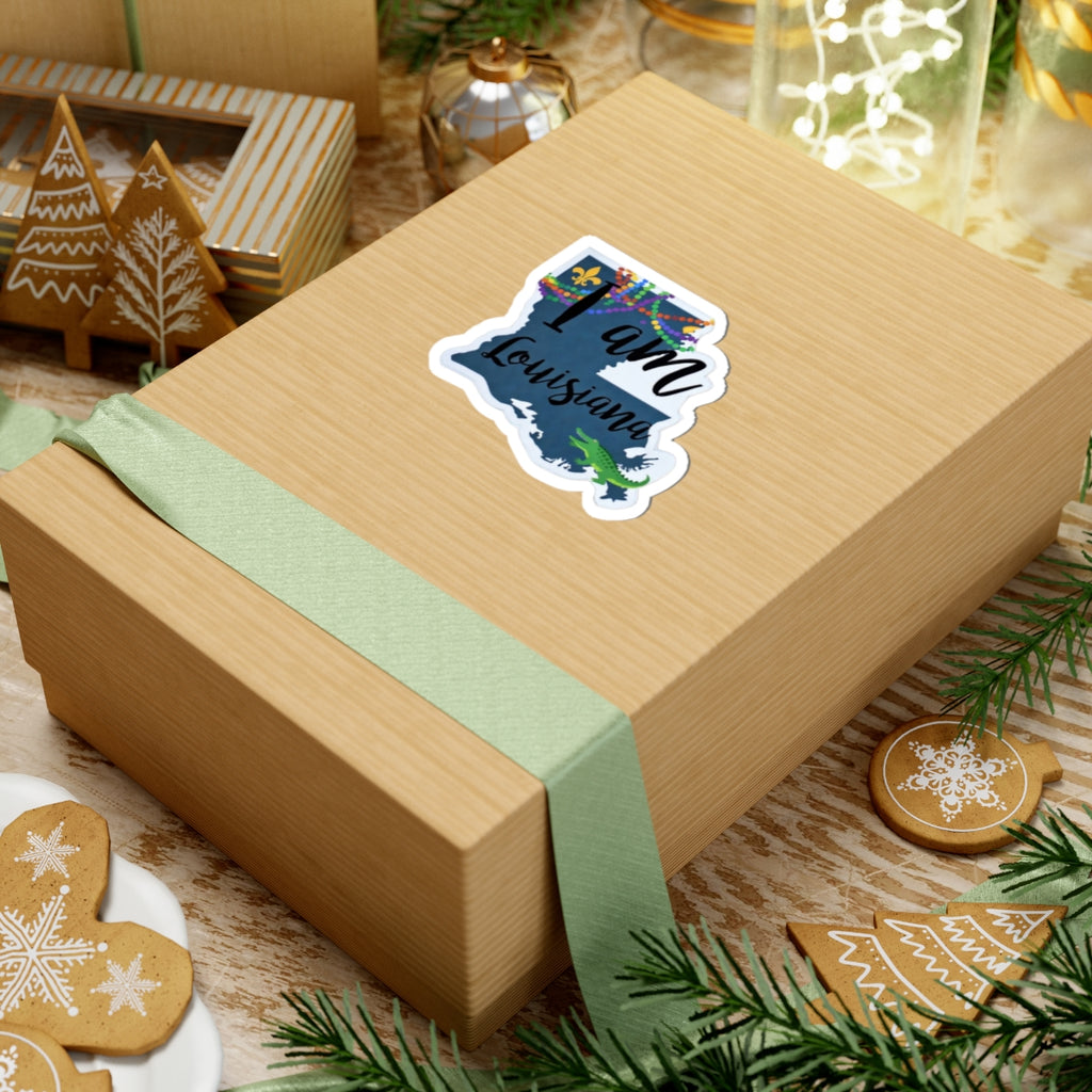 I Am Louisiana sticker on gift box, die-cut outline with fleur-de-lis and alligator