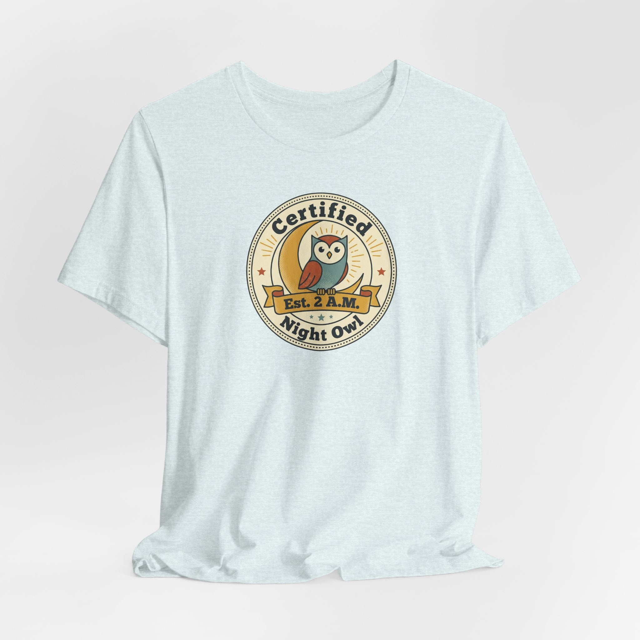 Light blue T-shirt with Certified Night Owl badge graphic on chest