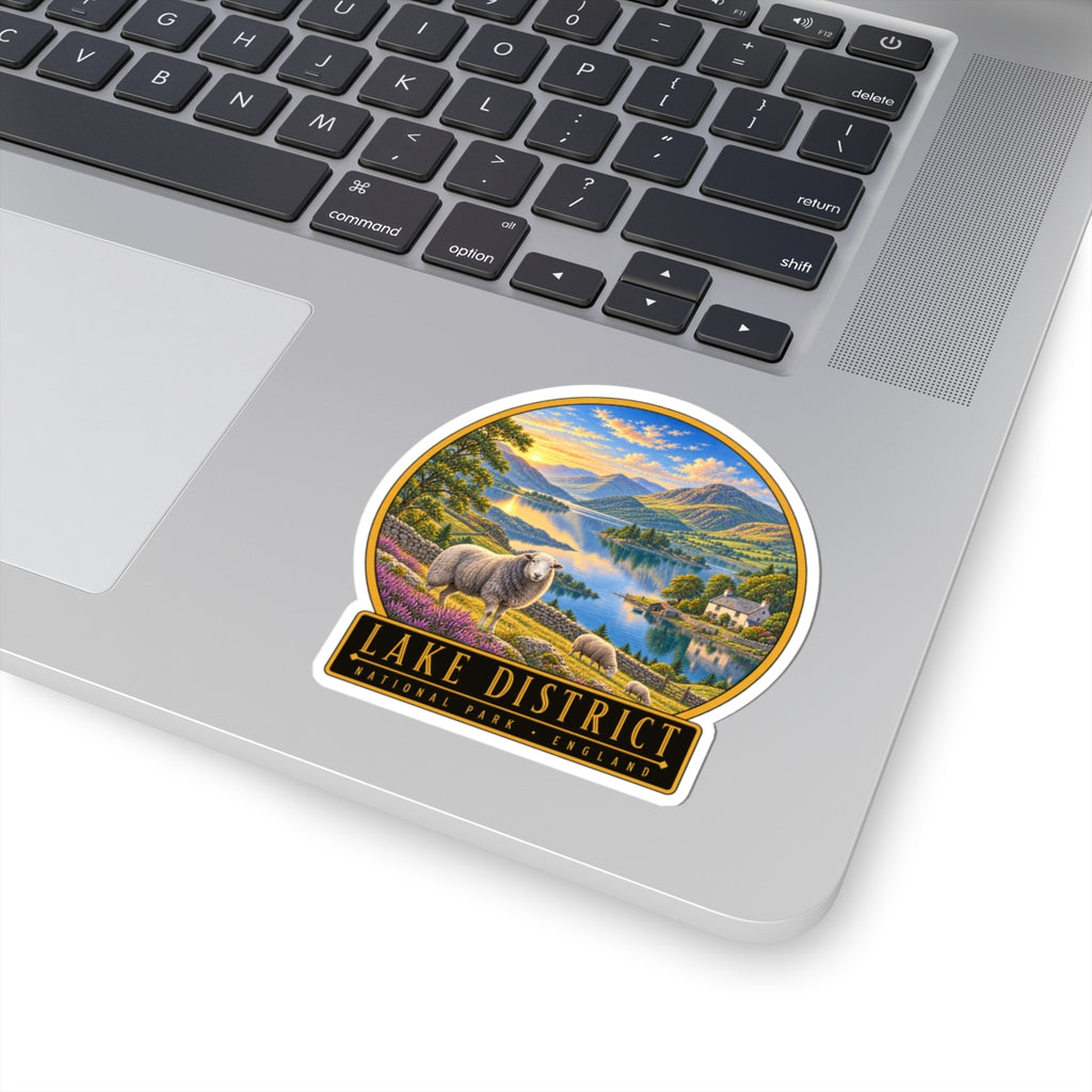 Lake District vinyl sticker on a laptop keyboard showing sheep, lake scenery, and “Lake District England”