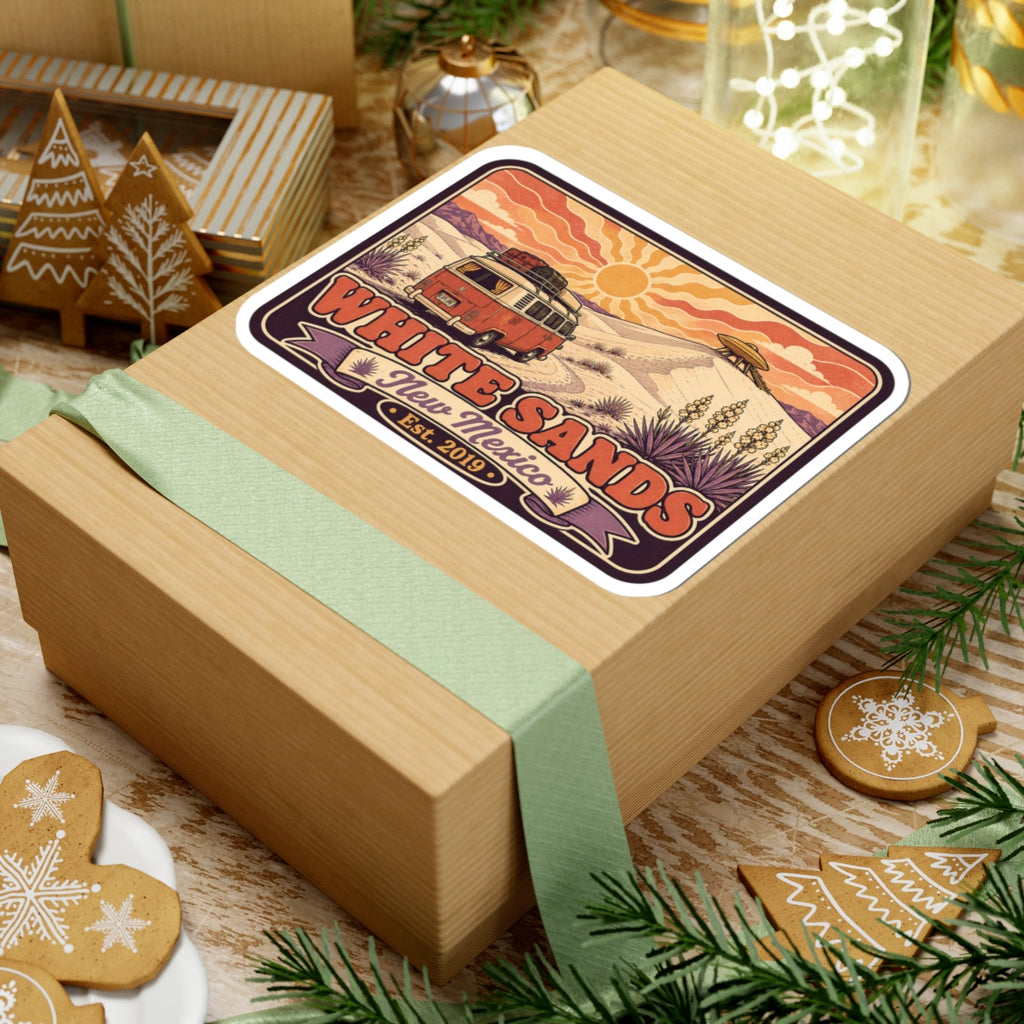 Vinyl sticker on wrapped gift; vintage camper desert scene with White Sands banner