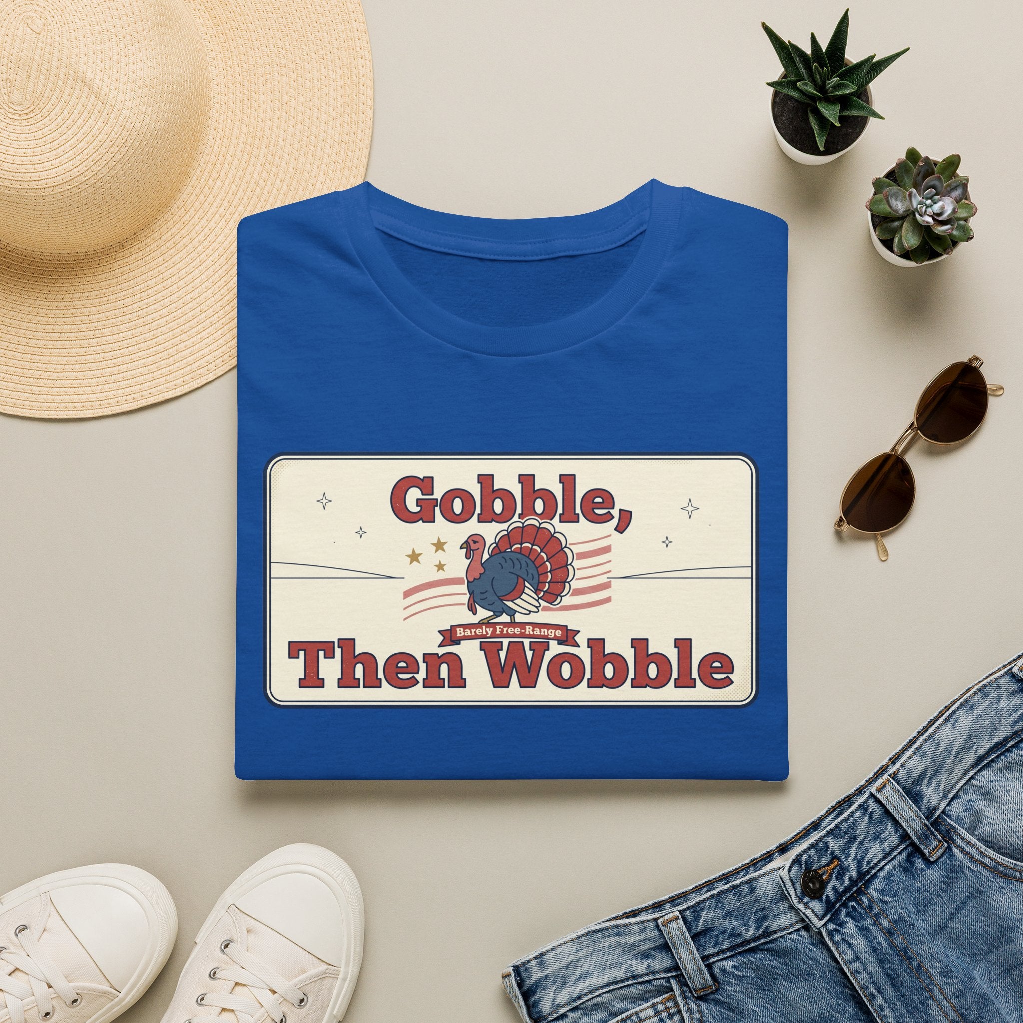 Royal blue T-shirt with retro turkey graphic and bold “Gobble, Then Wobble” text