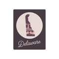 Mauve metal wall art sign with circular Delaware silhouette and script word