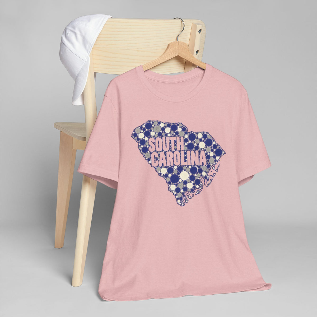 Dusty pink T-shirt with blue dotted South Carolina outline graphic on front.