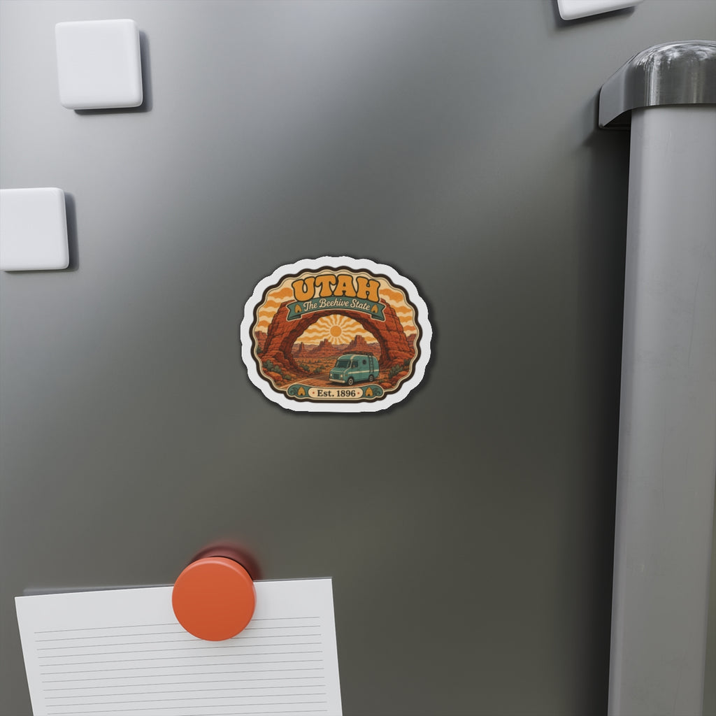 Utah scenic arch die-cut magnet on metal surface, showing vintage van, sun, “The Beehive State,” “Est. 1896.”