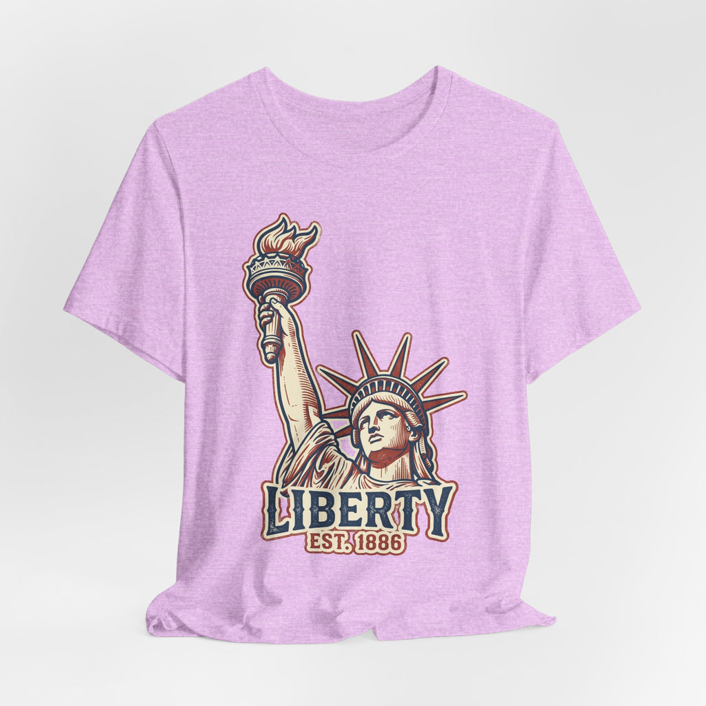Lavender graphic tee with Liberty Statue illustration and EST. 1886 text