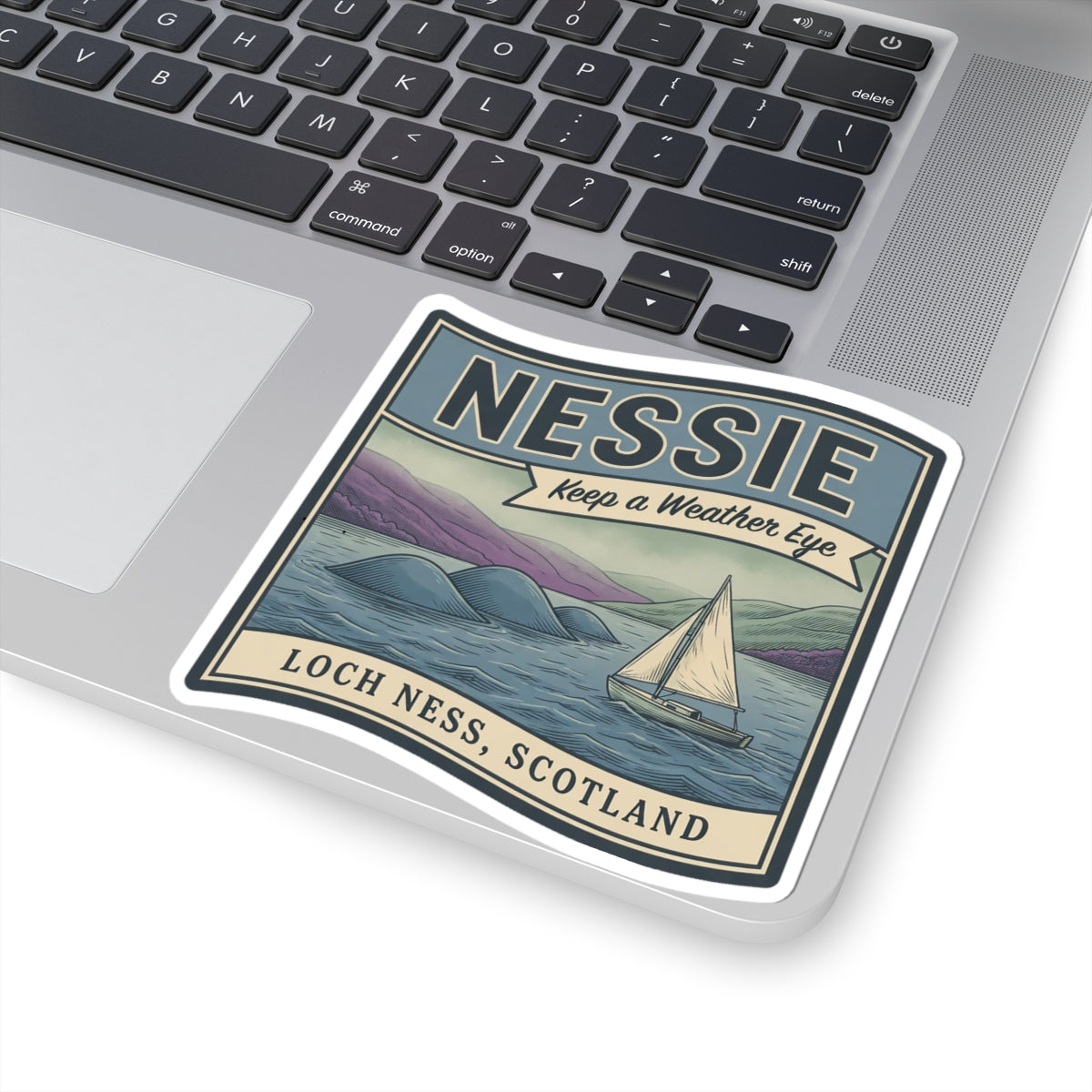 Square Loch Ness Scotland sticker on a laptop screen area with Nessie and sailboat scene