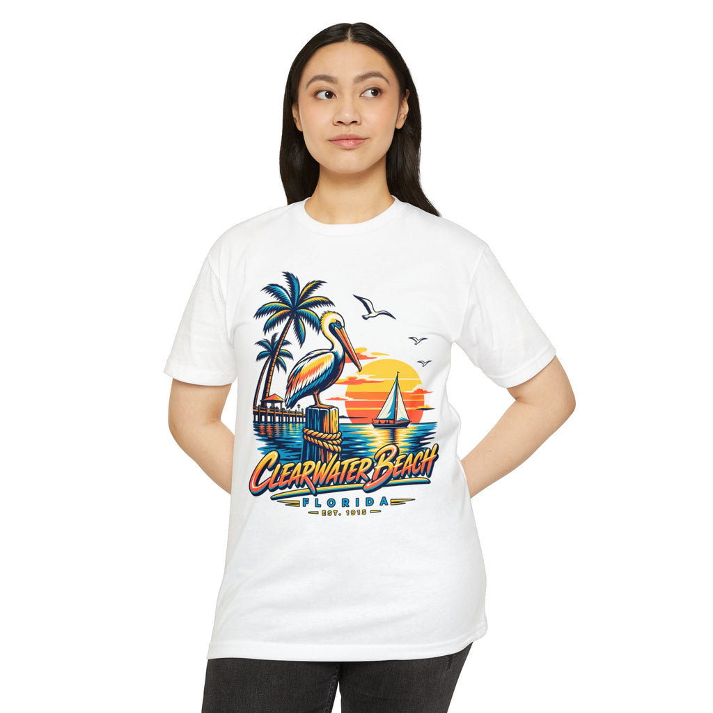White T-shirt with colorful pelican, palm trees, sailboat sunset graphic.